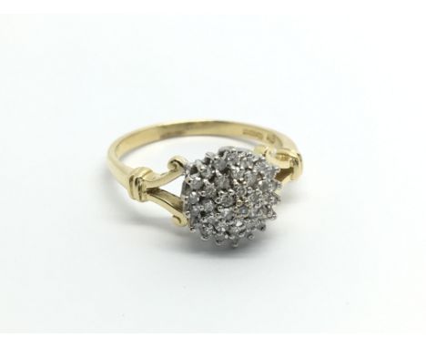 An 18carat gold ring set with a cluster of diamonds ring size O