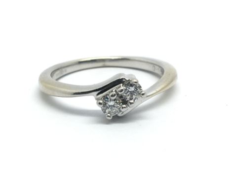 An 18ct white gold and two stone diamond ring, approx 0.15ct, ring size approx L