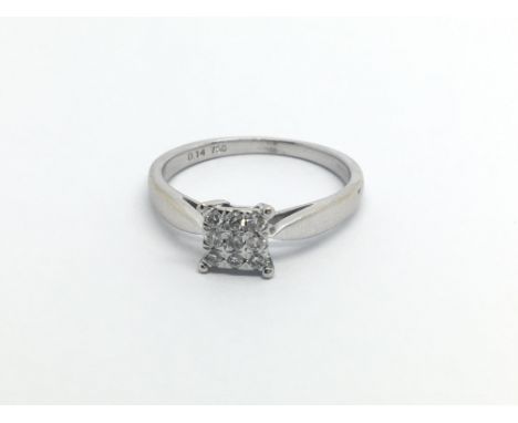 An 18carat white gold ring set with a square pattern of diamonds ring size K-L