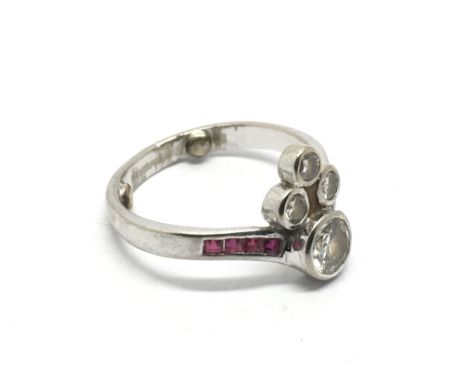 An Art Deco design 18ct diamond and ruby ring, approx 4.6g and approx size N.
