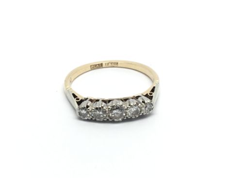 An 18carat gold ring set with a row of five diamonds ring size N-O.