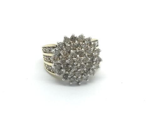 A large 18carat gold diamond cluster ring set with a pattern of diamonds approximately 1.50 carat weight ring size L-M