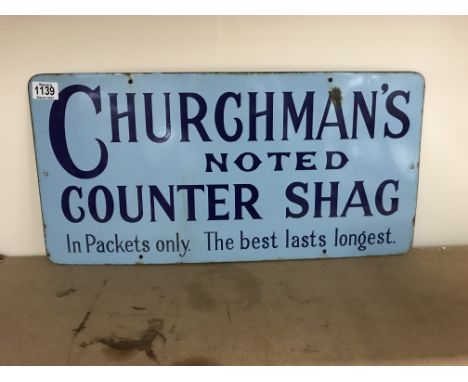 Vintage enamel sign for Churchmans noted counter shag measuring 60cm x 30cm