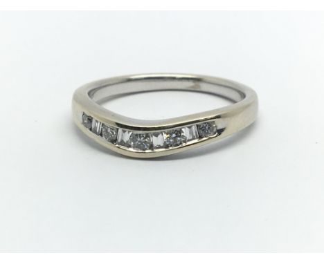 An 18ct white gold and diamond wish bone ring, approx 0.12ct, ring size approx J/K