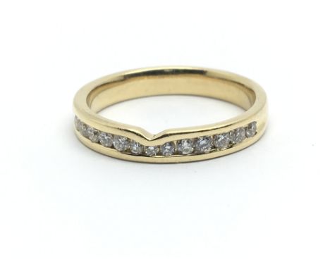 An 18ct yellow gold half eternity ring having a row of thirteen diamonds, approx 0.25ct, ring size approx N/O