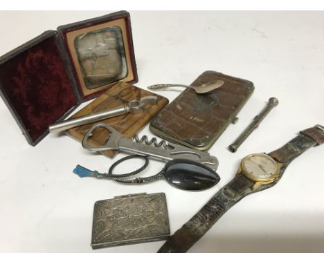 A collection of oddments comprising wrist watch, filigree note book, silver propelling pencil, enamel spoon and other objects