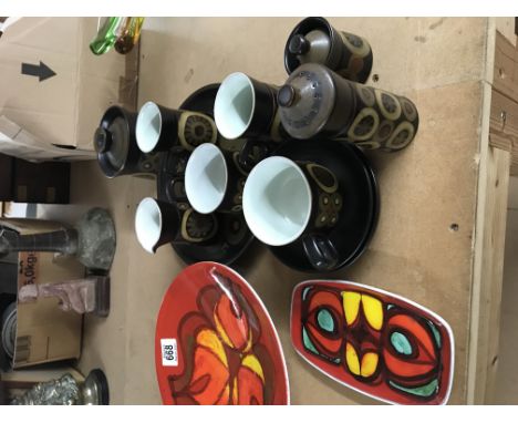 A Poole pottery circular dish and a small dish together with Denby items .
