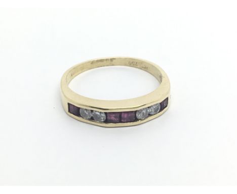 An 18carat gold ring set with a row of ruby and diamonds ring size P.