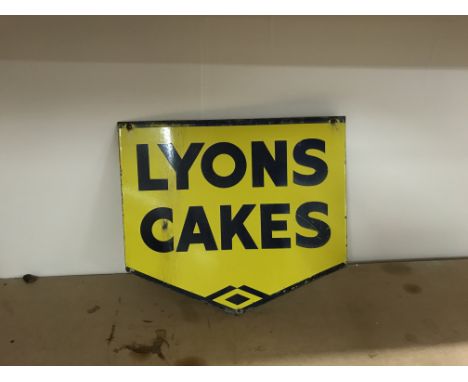 Vintage enamel double sided Lyons Cakes Width: 45cm. Height on longest point: 39.5cm. Slight edge on one side measuring 5cm.