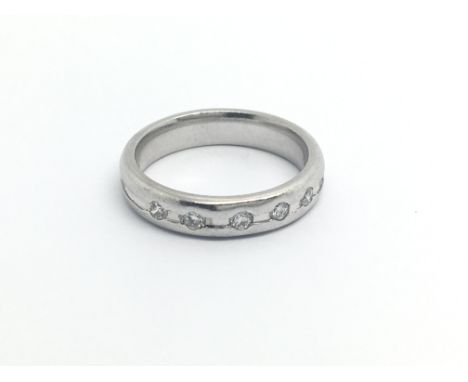 An 18carat white gold modern design ring set with five diamonds ring size L