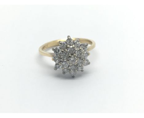 An 18carat gold ring set with a cluster of diamonds ring size J-K