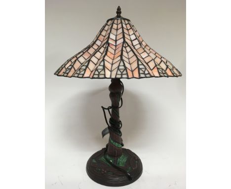 A Tiffany style lamp, base decorated With dragonflies, with a peach coloured shade. Height 58cm approx