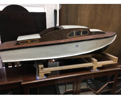 A hand made model motor boat ( in need of attention). 129cm.