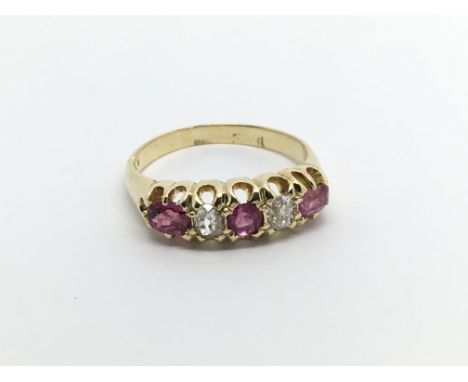 An 18carat gold ring set with ruby and diamonds ring size L