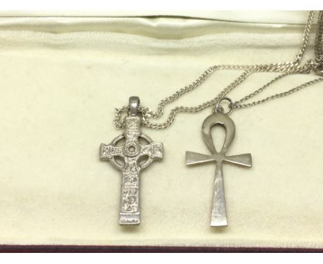 Two silver cross pendants on chains comprising a Celtic example and one other.