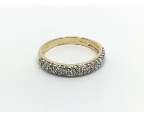 An 18 carat gold ring half hoop eternity ring set with three rows of diamonds ring size O.