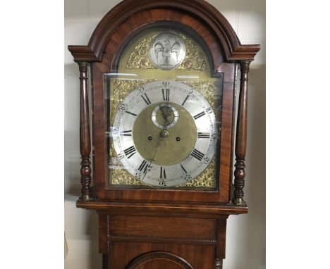 A Quality mid 19th century mahogany long case clock with a brass dial and silvered chapter ring the arch set with an eagle em