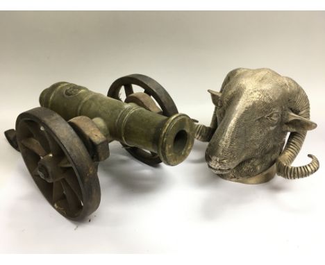 A silver plated rams head together with a brass and cast iron model cannon - NO RESERVE