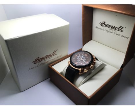 A boxed Ingersoll gents chronograph watch with brown face and rose gold coloured Arabic and baton numerals.