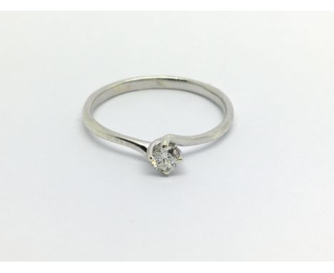 An unmarked possible 18carat white gold ring set with a round brilliant cut Solitaire diamond Approximately 0.15 of a carat r