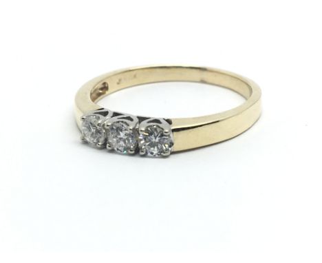 A 9ct yellow gold and three stone diamond ring, approx 0.25ct, ring size approx N/O