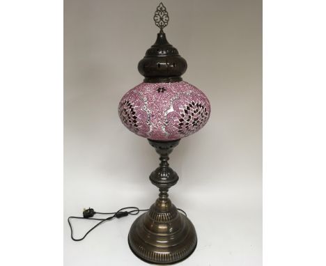 A similar lot in pink and silver with finial. Height 90cm approx