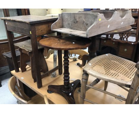 An early Victorian rosewood veneered occasional table, the circular top on a turned and ringed pedestal to tripod platform ba