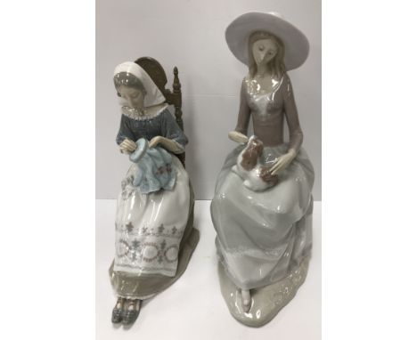 A Lladro figure of a woman embroidering 28 cm high together with a further Lladro figure of a girl in large hat with dog upon