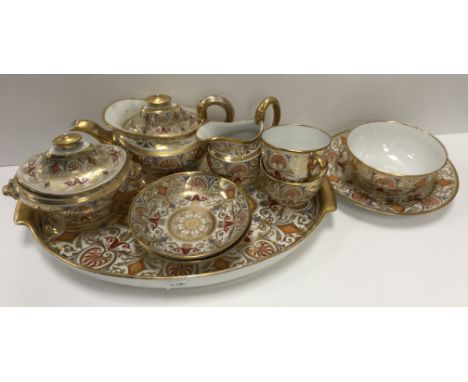 An early 19th Century Spode type gilt and polychrome decorated duet tea service comprising tray, tea pot, sucrier, milk jug, 