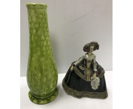 A Burmantofts faience green glazed incised baluster shaped vase on circular foot, stamped and No'd, to base "1400", 37.5 cm h