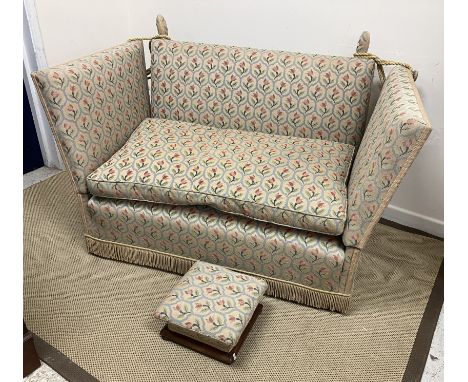 An upholstered Knole two seat sofa with all-over tulip lattice work design, 133 cm wide x 78 cm deep x 86 cm high, a similar 