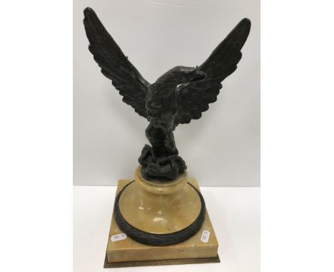 A 19th Century Grand Tour bronze spreadeagle figure on a sienna marble and bronze mounted socle base (formerly a globe stand)