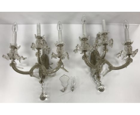 A pair of early 20th Century glass three light wall sconces with simulated candle lamps, 38 cm wide x approx 40 cm deep
