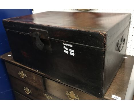 A Chinese lacquered trunk with brass carrying handles 70 cm x 45 cm x 32 cm high