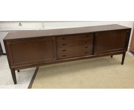 A mid to late 20th Century Danish mahogany sideboard in the manner of H W Klein for Bramin, the plain single piece top over f