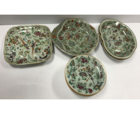 A collection of 19th Century Chinese celadon glazed famille rose dinner wares decorated with butterflies and flowers and exot