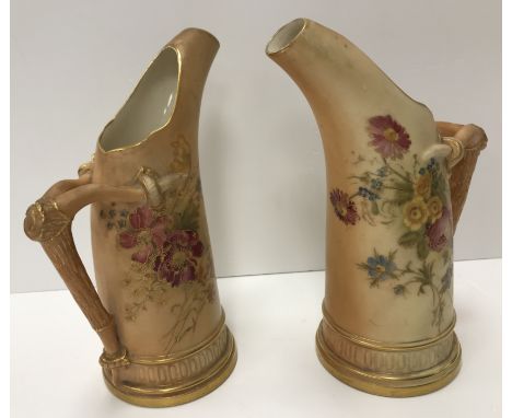 A pair of Royal Worcester blush ware tusk jugs, each decorated with floral sprays, dated 1918 and No'd. "1116" to base, both 