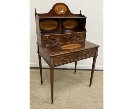A late 19th Century mahogany and satinwood inilaid bonheur du jour by Edwards & Roberts of London, the superstructure with tw