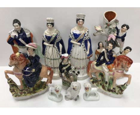 A collection of ten 19th Century Staffordshire figures including Victoria and Albert standing 27.5 cm high, another similar f