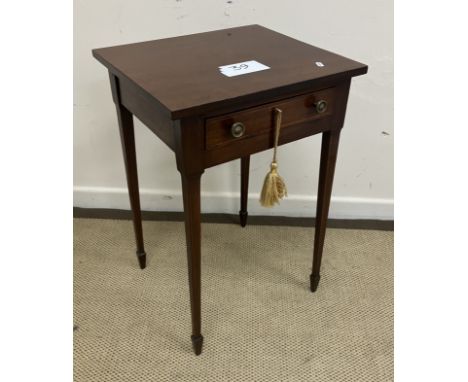 A circa 1900 mahogany lamp or side table, the plain top over a satinwood strung single drawer with turned brass knob handles,