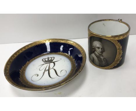 An 18th Century Meissen cup and saucer, royal blue ground and gilt decorated, the main gilt wreath medallion enclosing a port