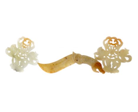 PAIR OF CHINESE ARCHAIC STYLE HARDSTONE AMULETS, possibly jade, one modelled as a dagger with mythical creature handle, 15cm 