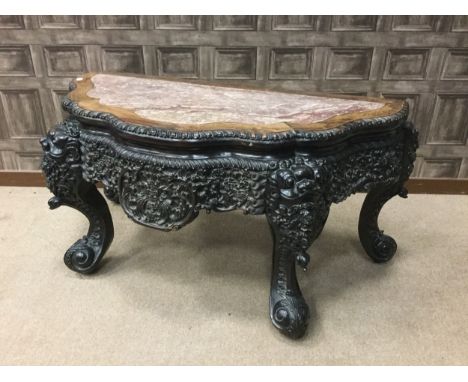 UNUSUAL EARLY 20TH CENTURY CHINESE IRONWOOD CONSOLE TABLE, with inset marble top over ebonised wood frieze profusely carved w