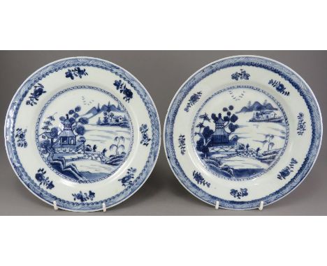 Two mid-eighteenth century hand-painted blue and white Chinese porcelain plates, c. 1750-70. Each is decorated with a landsca