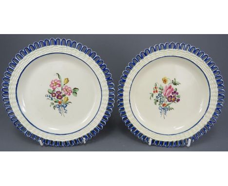 A pair of early nineteenth century creamware hand-painted arcaded plates, c. 1815-20.  They are decorated with floral sprays 