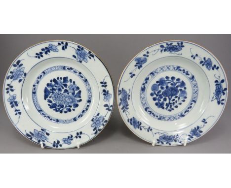 Two mid-eighteenth century hand-painted blue and white Chinese porcelain plates, c. 1750-70. Each is decorated with a design 