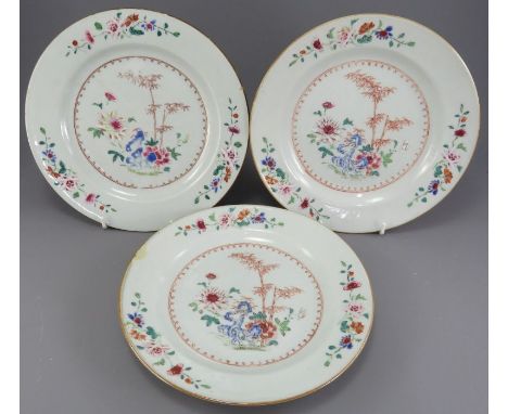 A group of three mid-eighteenth century hand-painted famille rose Chinese porcelain plates, c. 1750-70. Each is decorated wit