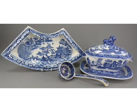 An early nineteenth century blue and white transfer-printed Willow pattern sauce tureen cover, stand and ladle and a Spode Fl