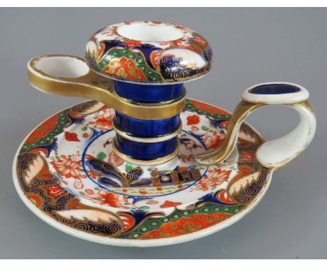 An early nineteenth century Spode porcelain hand-painted pattern 957 chamberstick, c. 1820. It is marked to the underside. 12