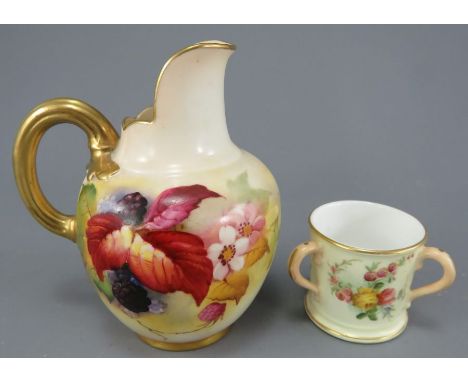 An early twentieth century Royal Worcester hand-painted porcelain autumnal fruit jug and similar blush ivory three-handled mi